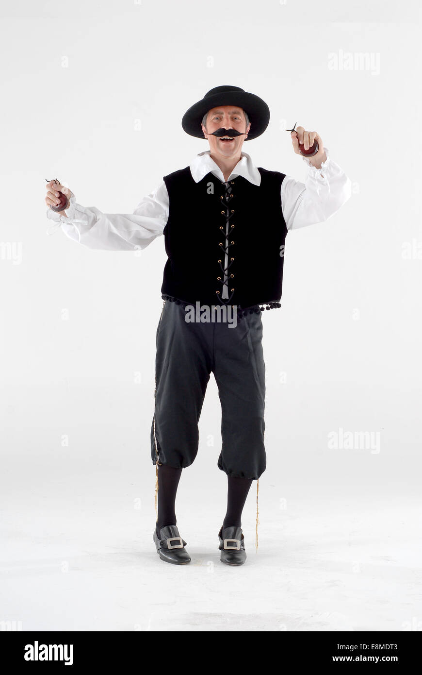 man in fancy dress comedy costume in a traditional spanish mandolin, music player / busker outfit, with castanet's, Stock Photo