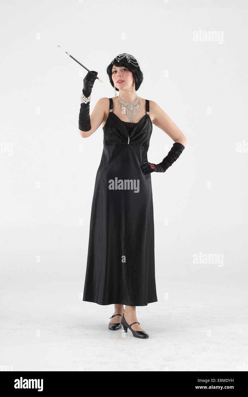 Woman in fancy dress comedy costume in a 1920s flapper fashion outfit Stock Photo