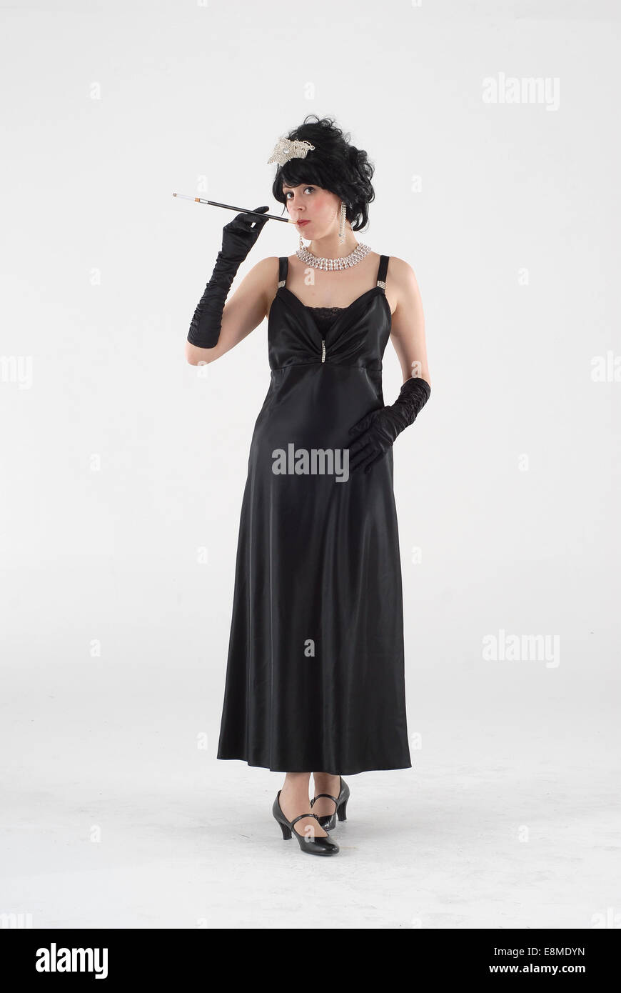 Woman in fancy dress comedy costume in a 1920s flapper fashion outfit Stock Photo