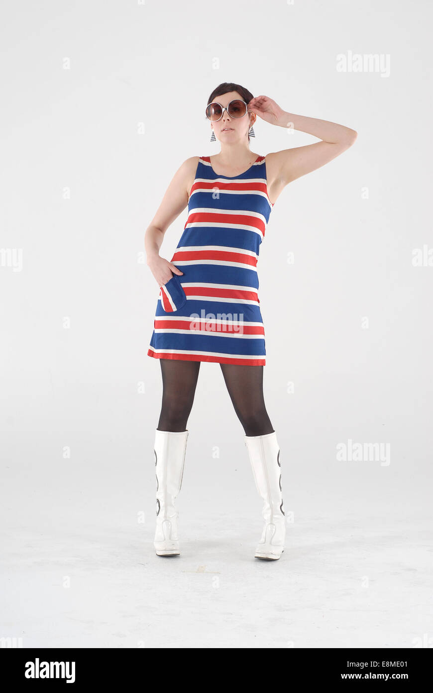 woman in fancy dress comedy costume in 1960s fashion and crazy funny mod outfit Stock Photo