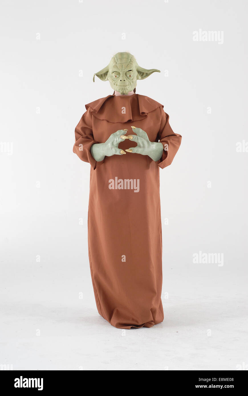 Woman in fancy dress comedy costume in a yoda outfit from starwars the science fiction film Stock Photo