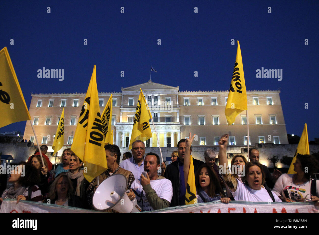 Athens, Greece. 10th Oct, 2014. Protestors shout slogans outside the Greek Parliament building during a rally in Athens, Greece, Oct. 10, 2014. Greek Parliament will vote Friday on a confidence motion proposed by Greek Government. According to local political analysts, the government is expected to easily win the roll-call vote sought by Greek Prime Minister Antonis Samaras in an effort to halt early general elections. Credit:  Marios Lolos/Xinhua/Alamy Live News Stock Photo