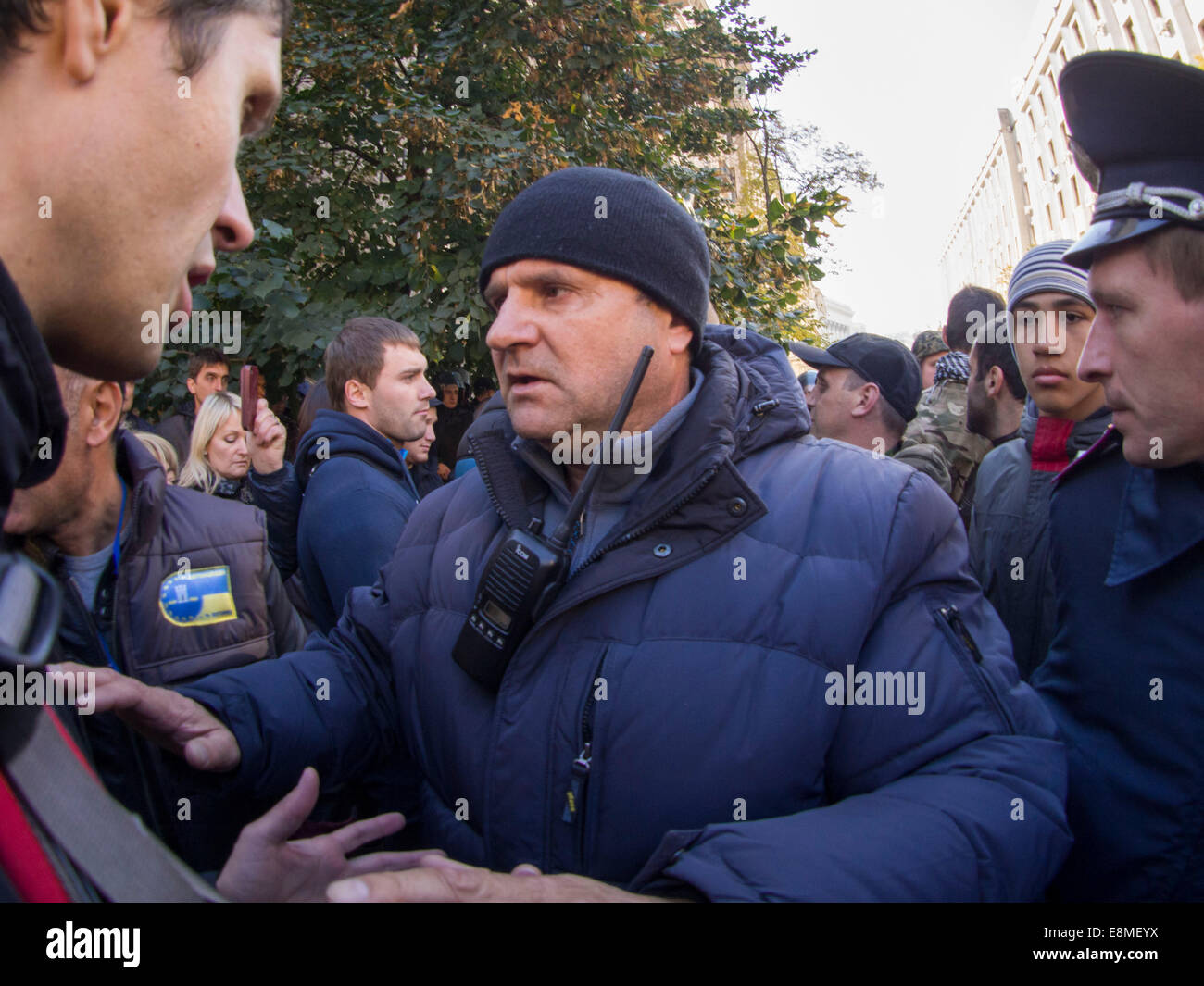 Ukraine. 10th Oct, 2014. Police officers try to calm the activists.Before the passage of the Presidential Administration from the street Instytutska has passed the action Avtomaydan against criminal proceedings are opened against the activists. One of the organizers of the rally Sergei Koba said that against him investigated the production, in particular, for their participation in equities, through which passed a law on lustration. Credit:  Igor Golovnov/Alamy Live News Stock Photo