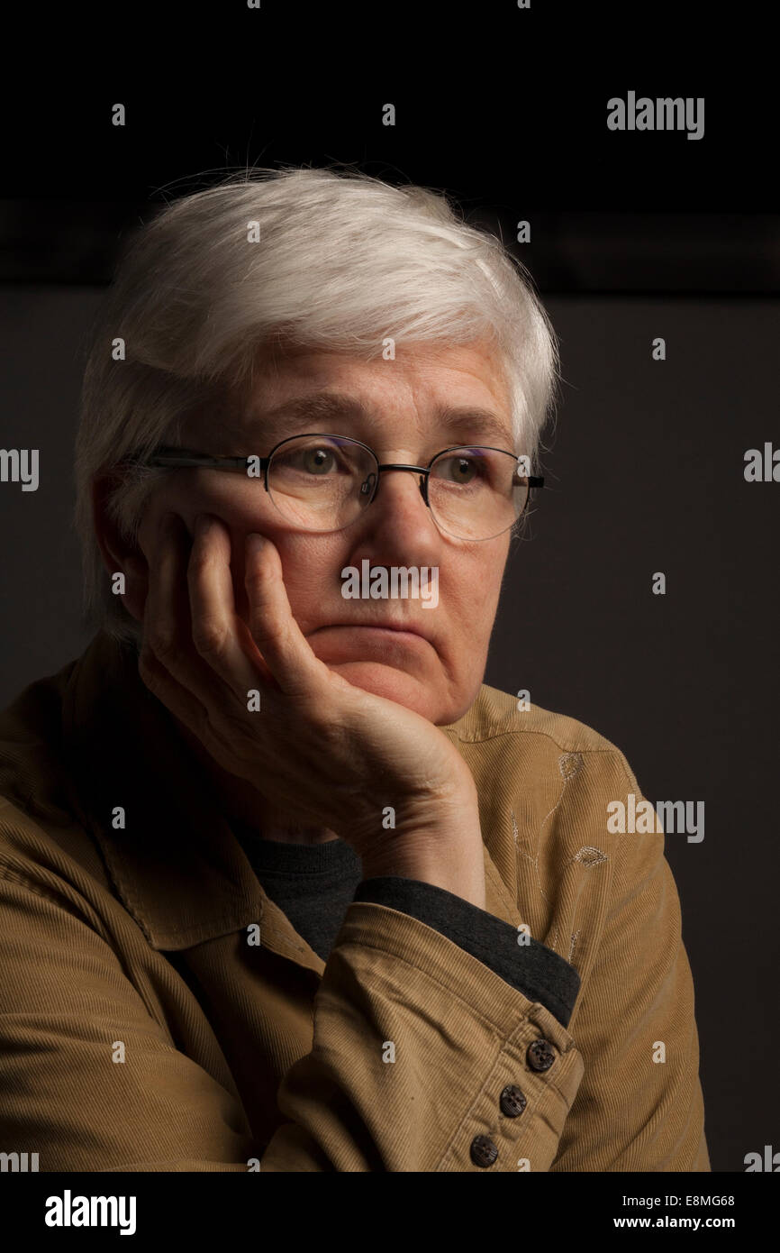 Caucasian woman poses with a sad expression. Stock Photo