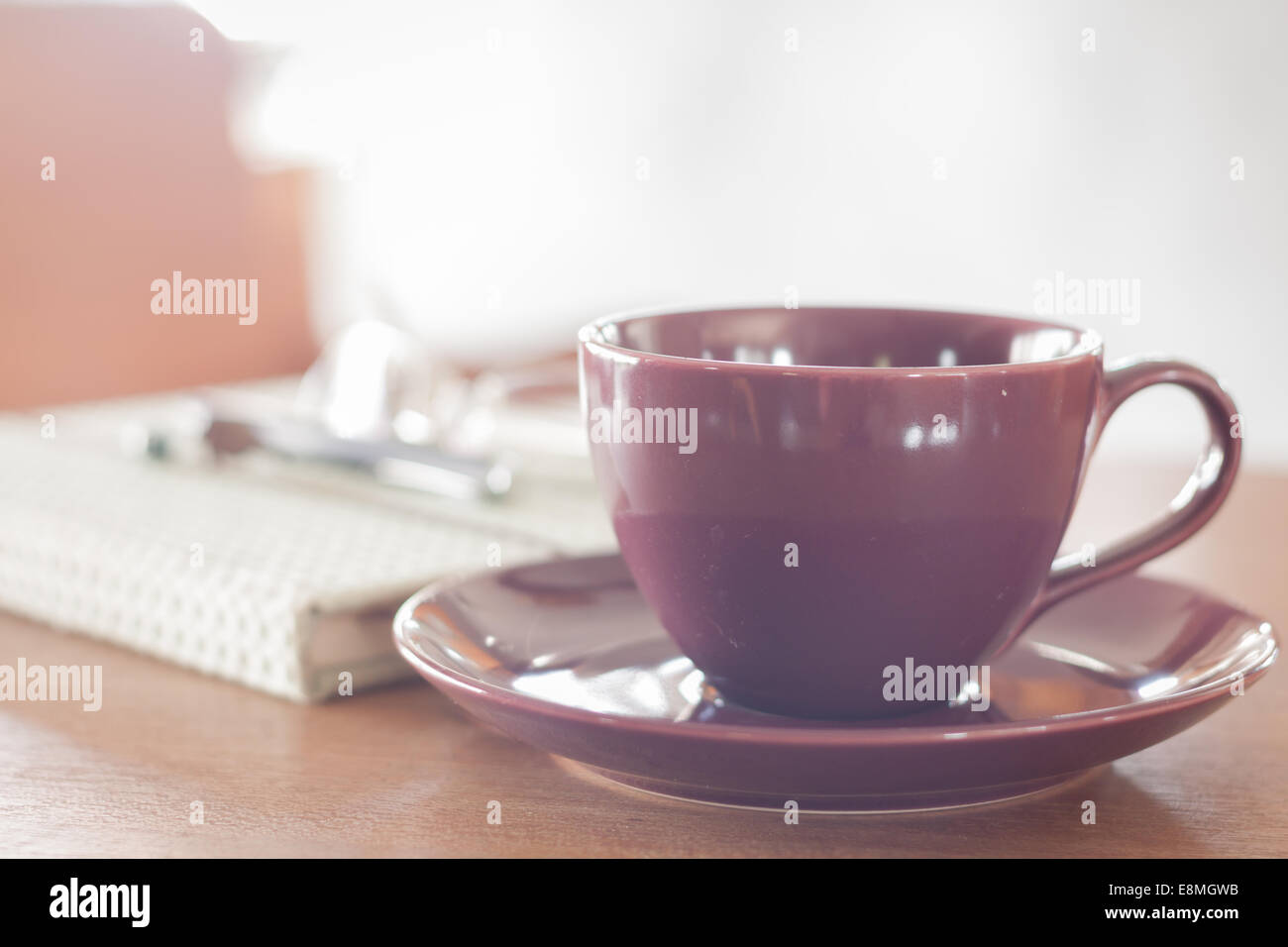 Violet cup of morning coffee or cappuccino and delicate purple, lilac  flowers. Mother's day concept. Cozy breakfast Stock Photo - Alamy