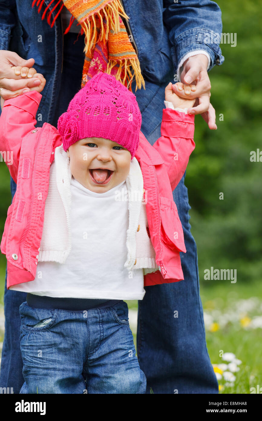 Baby's first steps Stock Photo - Alamy