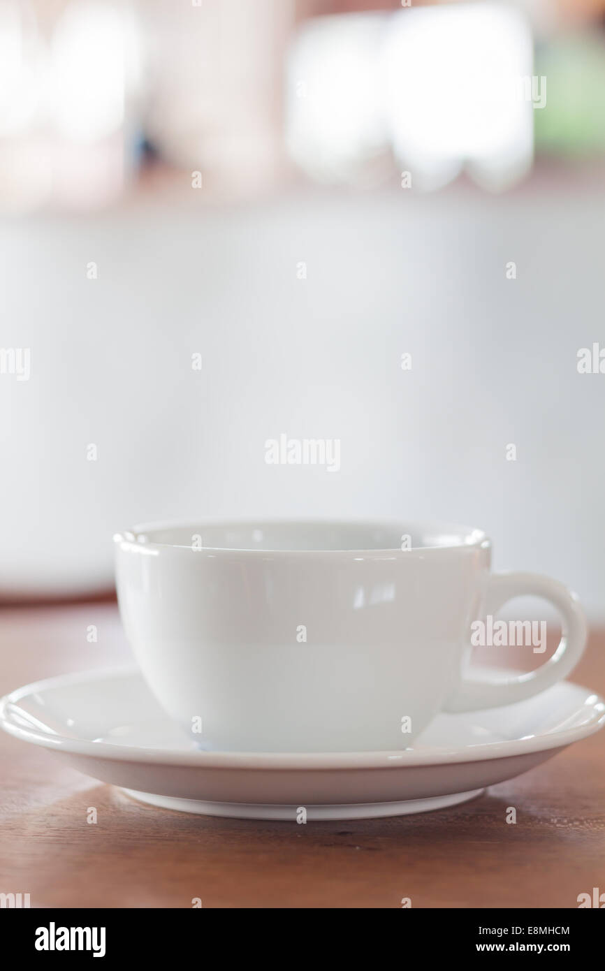White mug on wooden table, stock photo Stock Photo