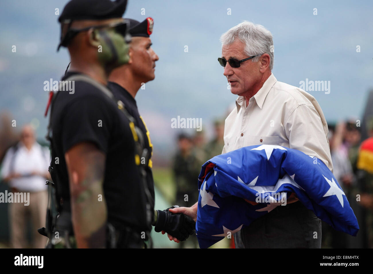 Melgar, Colombia. 10th Oct, 2014. U.S. Defense Secretary Chuck Hagel (R) takes part in a ceremony during his visit to the Tolemaida batallion in Melgar, Colombia, on Oct. 10, 2014. Credit:  Jhon Paz/Xinhua/Alamy Live News Stock Photo