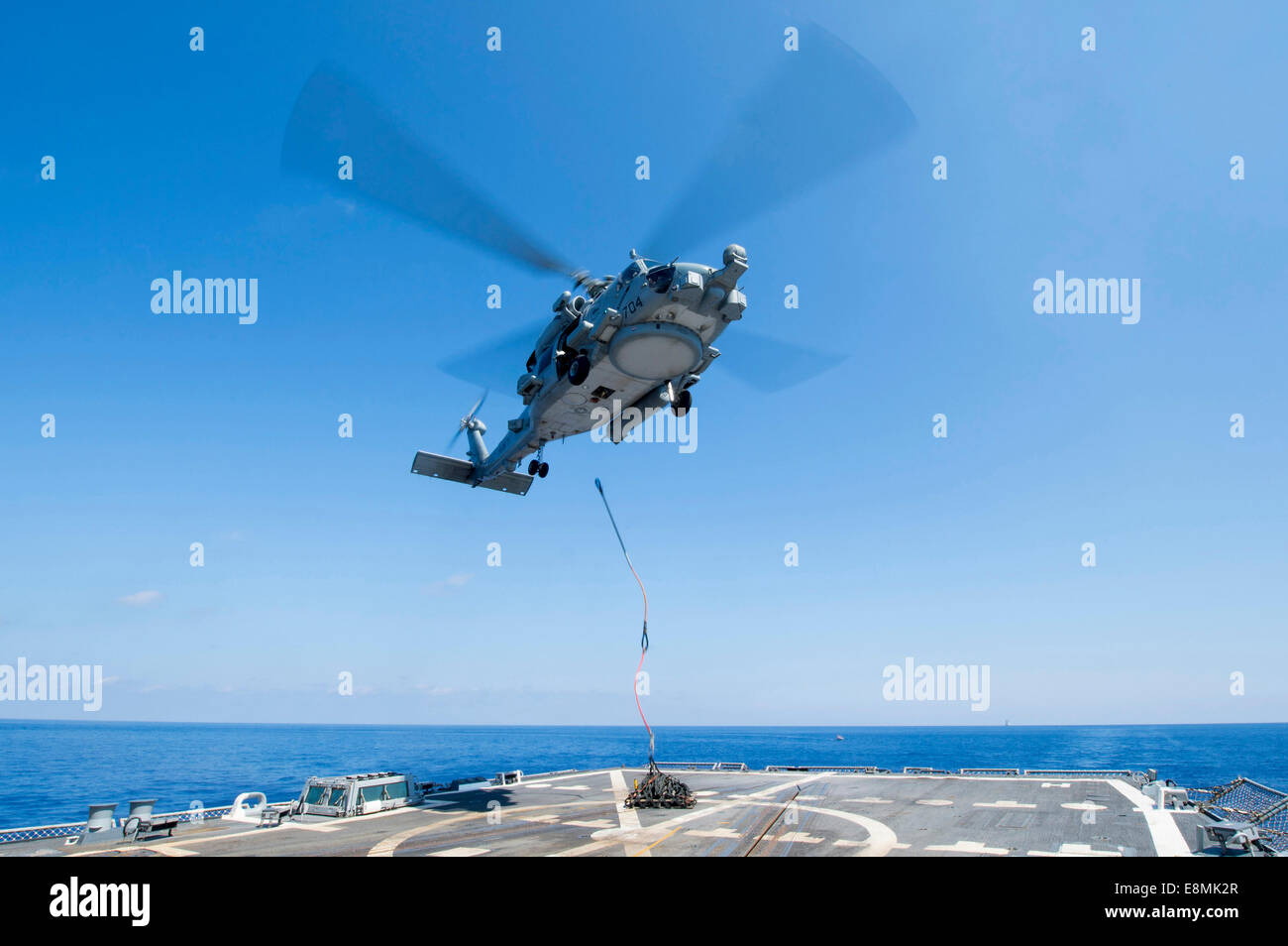 Mediterranean Sea, September 27, 2013 - An SH-60R Seahawk delivers supplies during a vertical replenishment-at-sea (VERTREP) wit Stock Photo