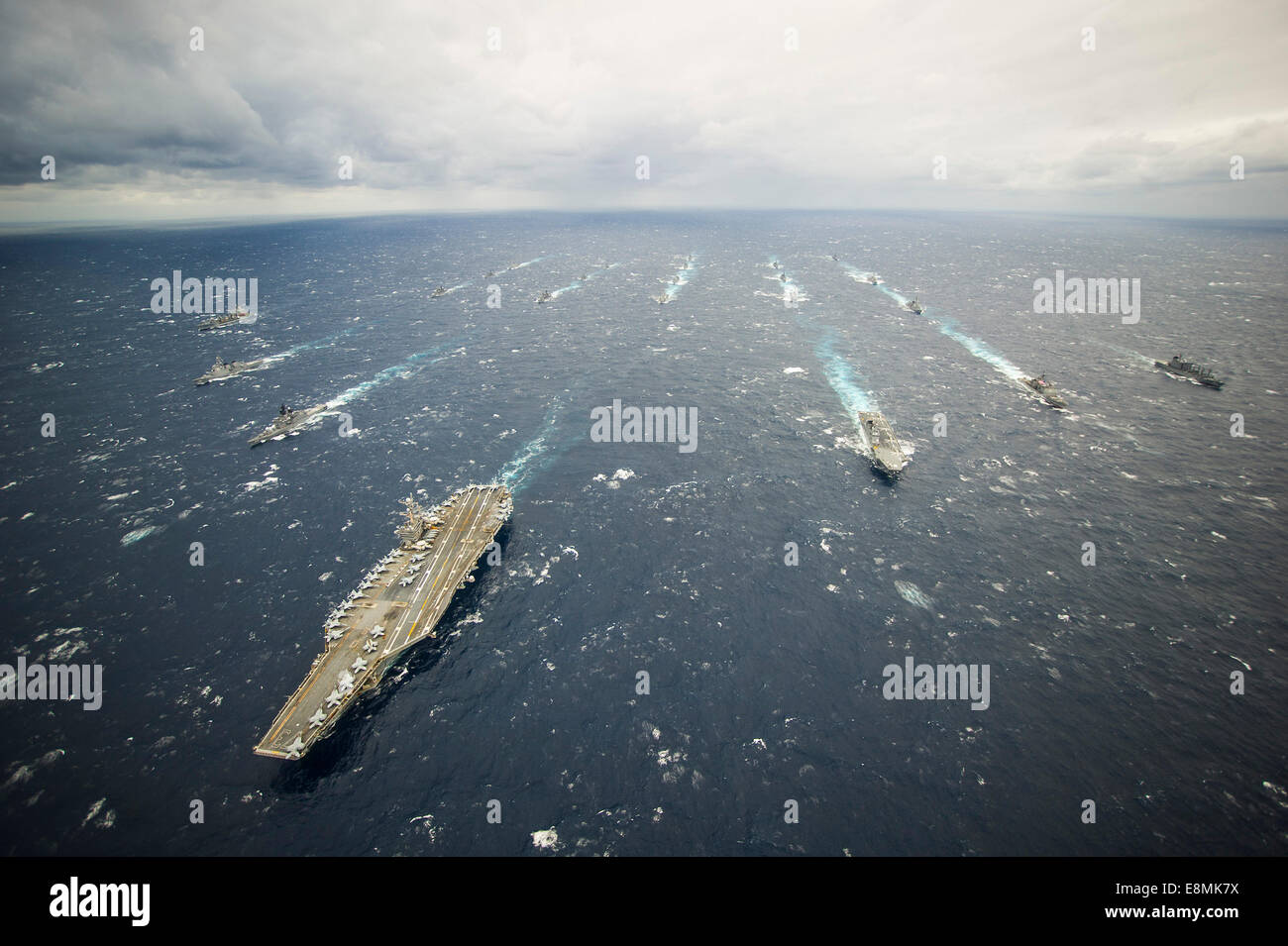 Philippine Sea, November, 28, 2013 - The aircraft carrier USS George Washington (CVN 73), left, the George Washington Strike Gro Stock Photo