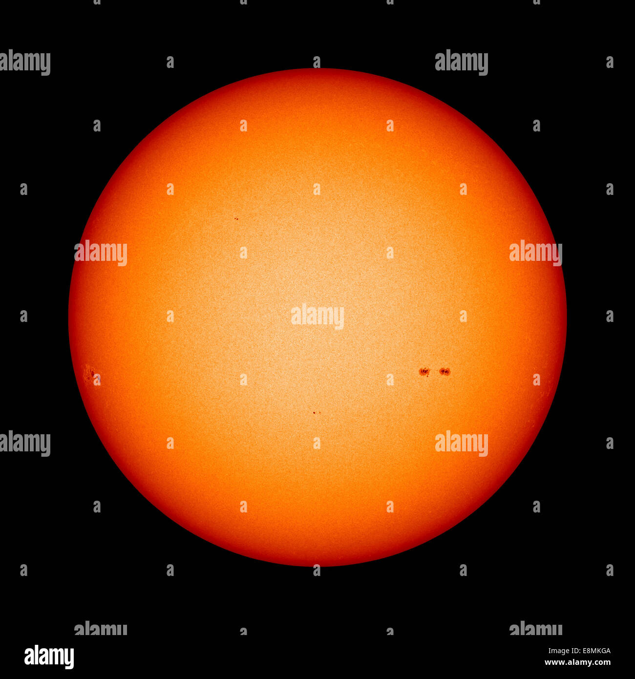 February 28, 2013 - View of the Earth-facing surface of the Sun showing just a few small sunspots. Stock Photo