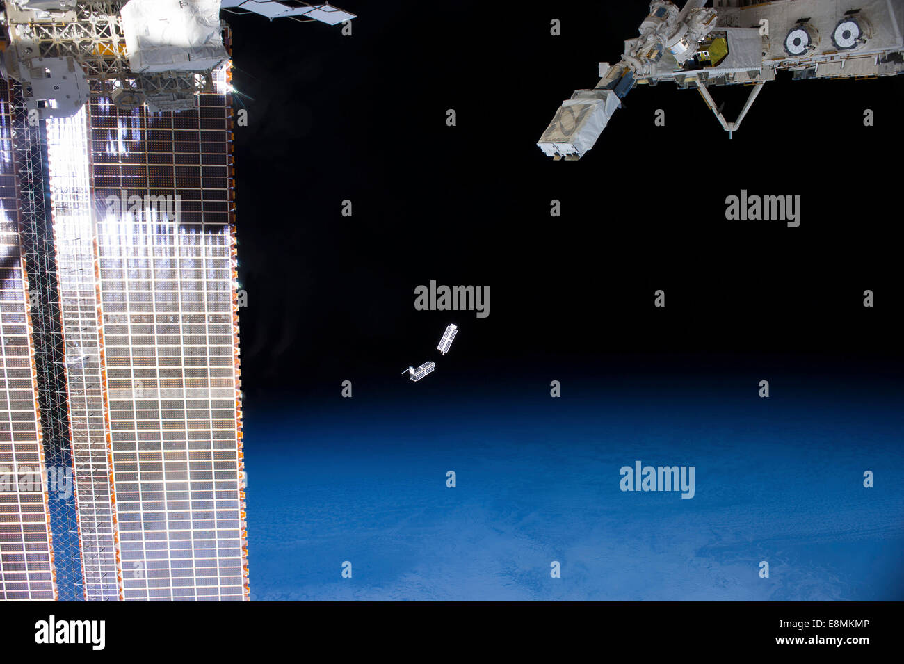 February 26, 2014 - A set of NanoRacks CubeSats after deployment by the NanoRacks Launcher attached to the end of the Japanese r Stock Photo