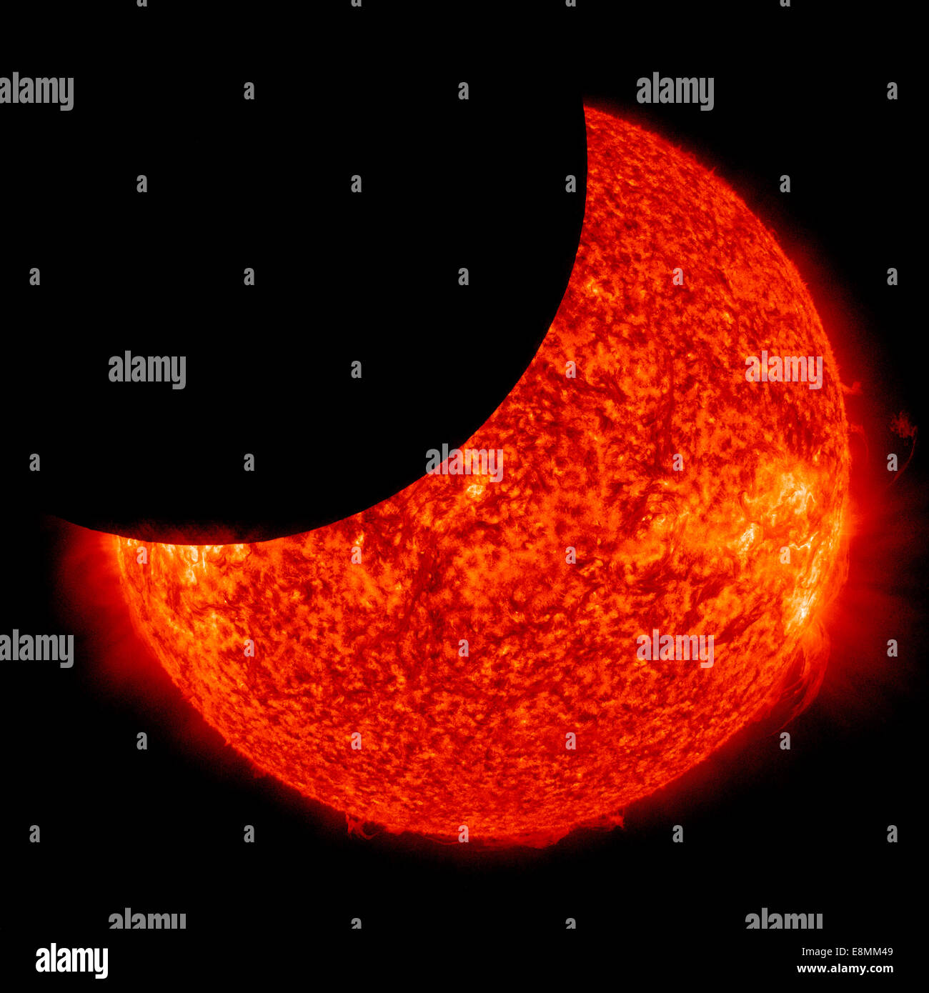 January 30, 2014 - The moon is seen moving between NASA's Solar Dynamics Observatory and the Sun, giving the observatory a view Stock Photo