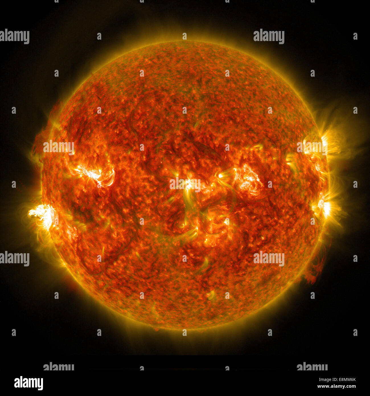August 24, 2014 - A solar flare erupting on the left side of the Sun. This flare is classified as an M5 flare. Stock Photo