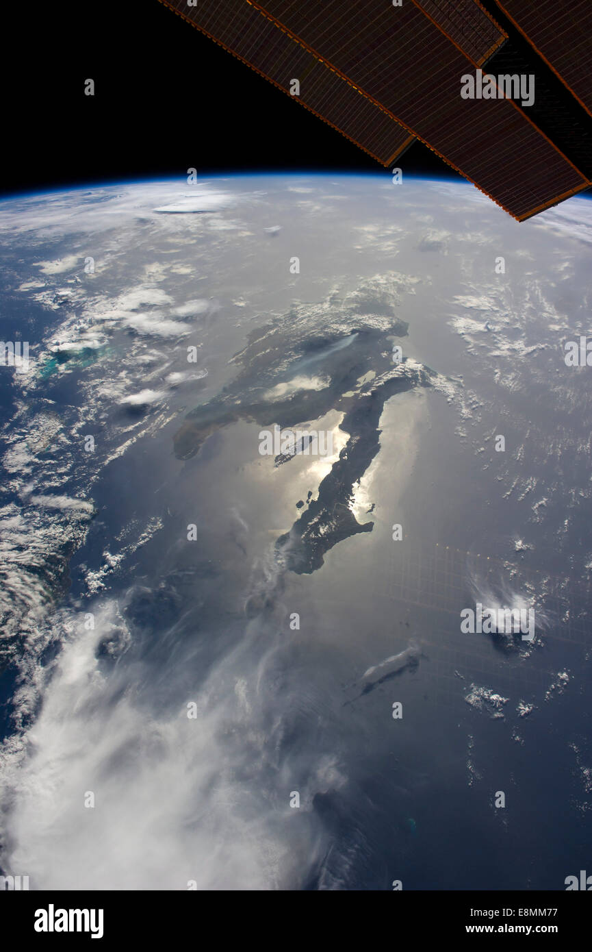 Looking east into a rising sun, the crew onboard the International Space Station (ISS) took this panoramic photo of the island o Stock Photo