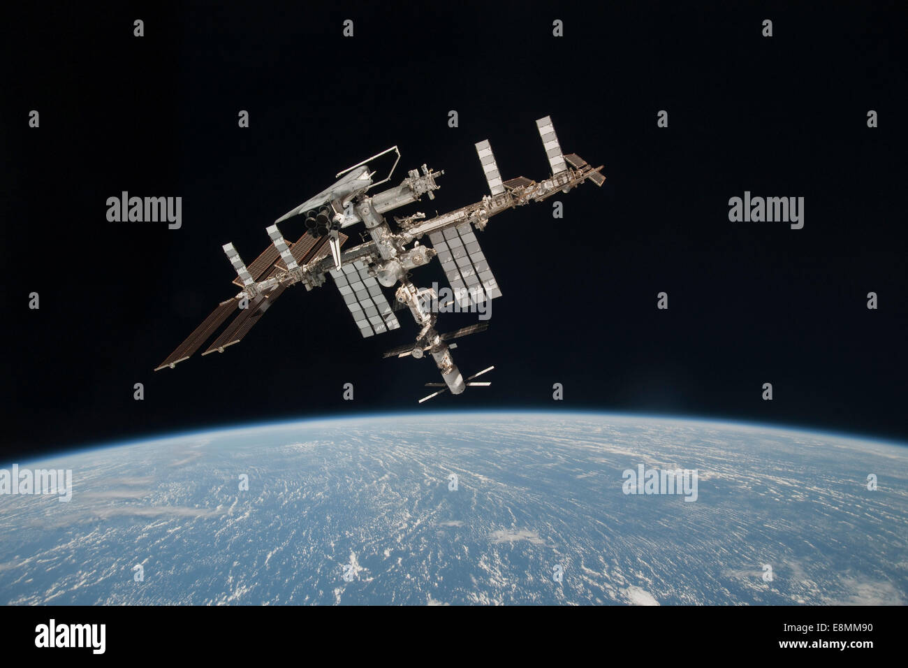 May 23, 2011 - The International Space Station and docked Space Shuttle Endeavour, backdropped by Earth and the blackness of spa Stock Photo