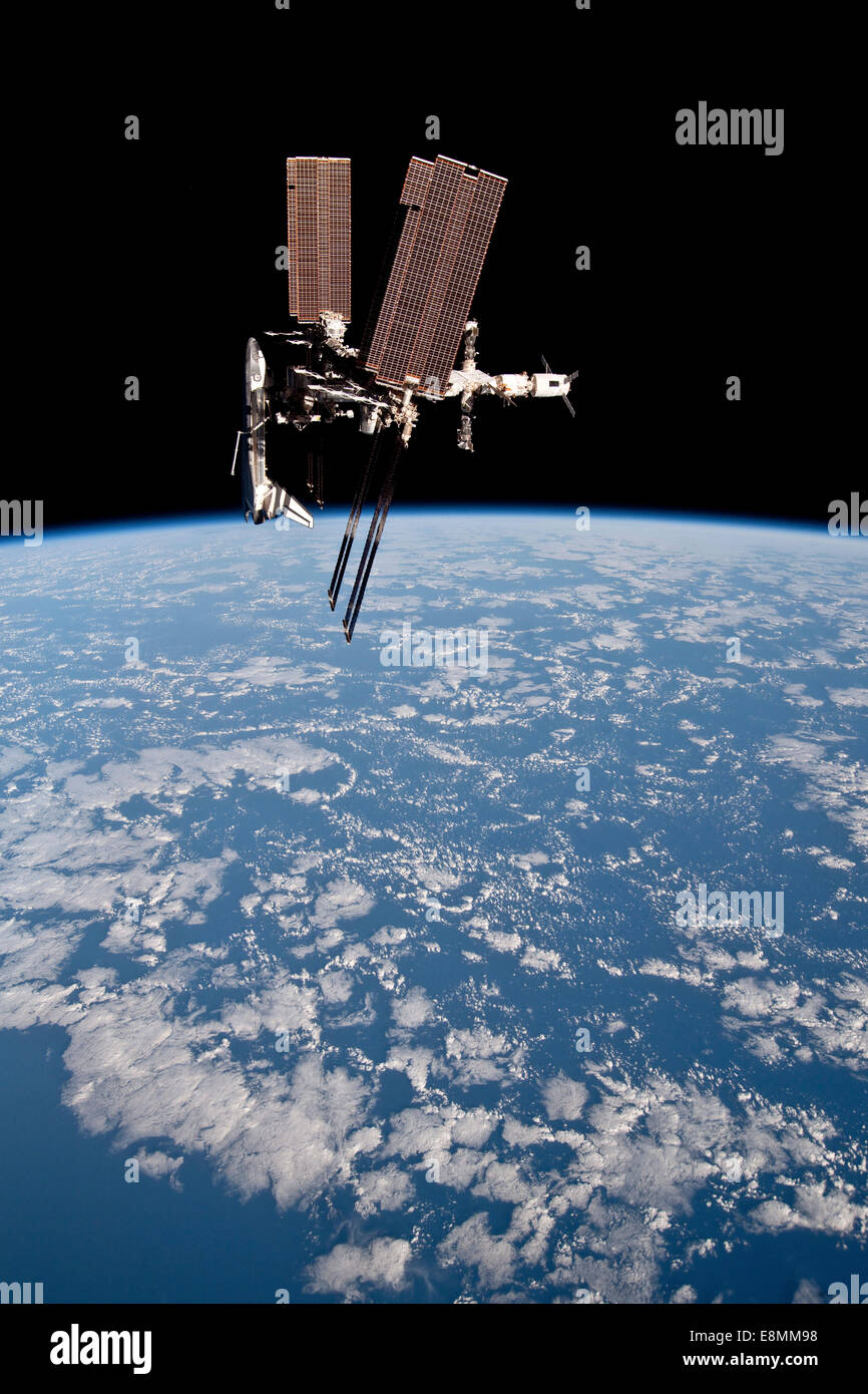 May 23, 2011 - The International Space Station and docked Space Shuttle Endeavour, backdropped by Earth and the blackness of spa Stock Photo