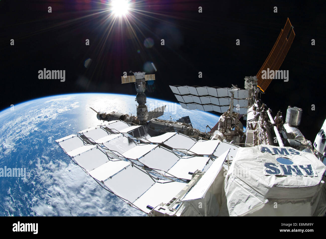 July 12, 2011 - View of the International Space Station with space shuttle Atlantis docked at the edge of the frame on the far r Stock Photo