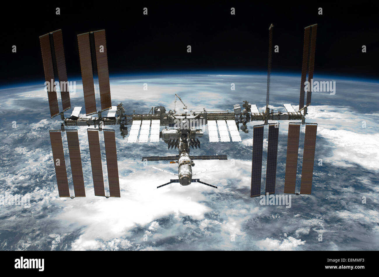 May 29, 2011 - The International Space Station backdropped by a blue and white Earth. Stock Photo