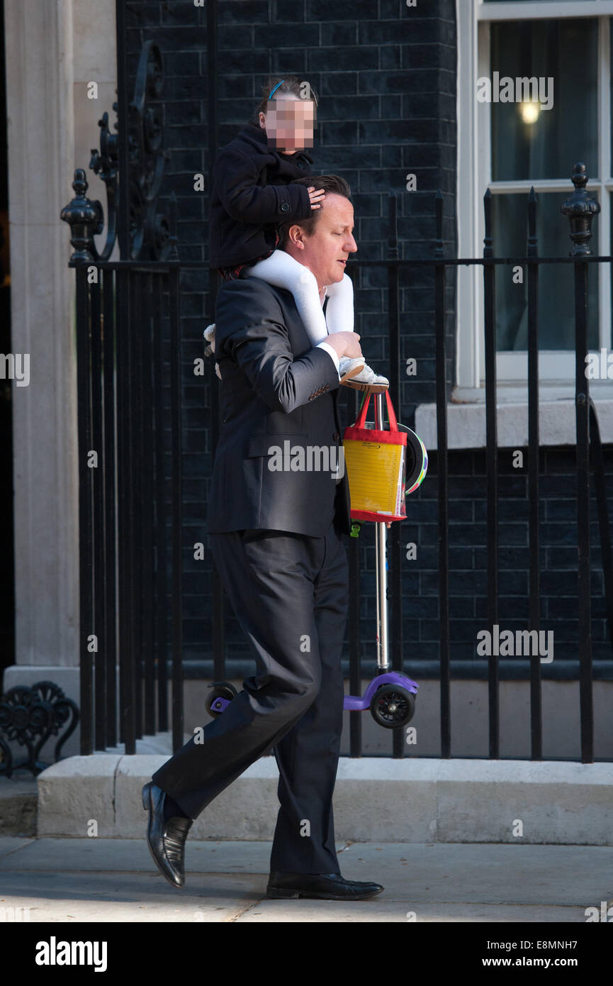 David Cameron leaves Downing Street carrying his daughter Nancy on his shoulders  Featuring: David Cameron,Nancy Cameron Where: London, United Kingdom When: 08 Apr 2014 Stock Photo