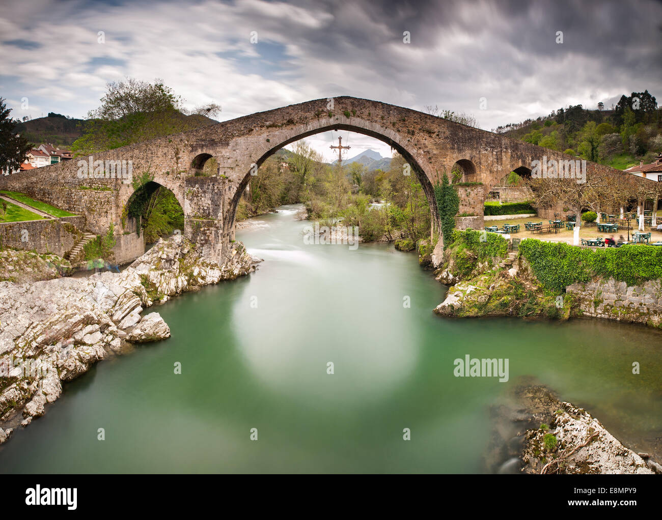 Old Roman stone bridge in Cangas de Onis (Asturias), Spain in a sunny day Stock Photo