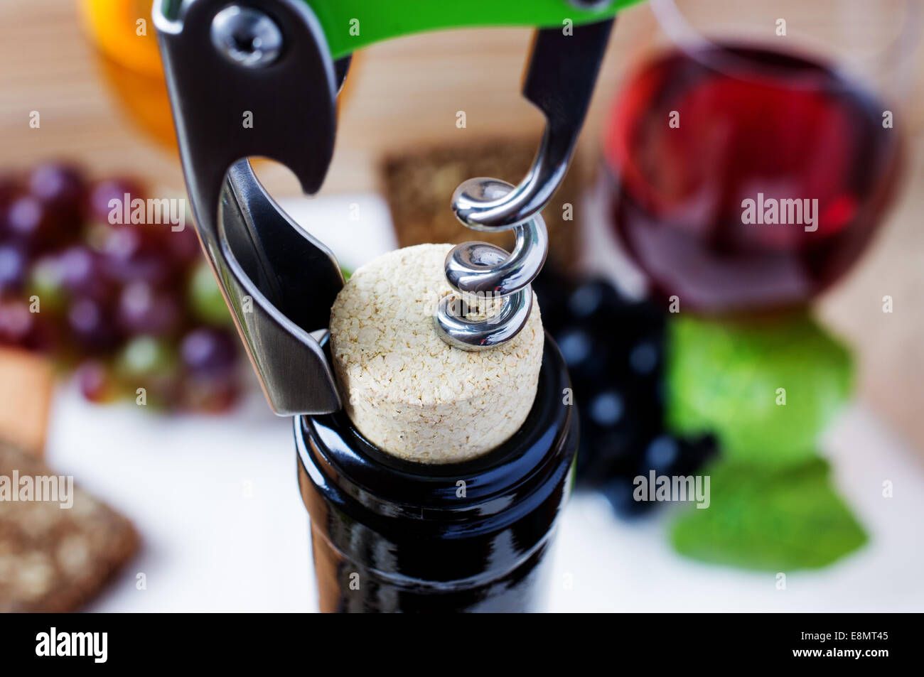Corkscrew opening a bottle of wine Stock Photo Alamy