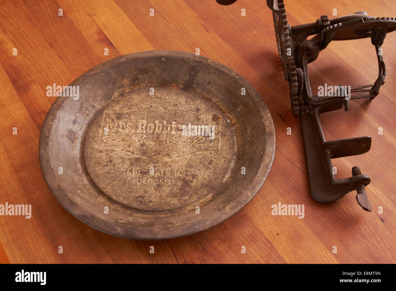 Empty pie tin & apple peeler Stock Photo Alamy