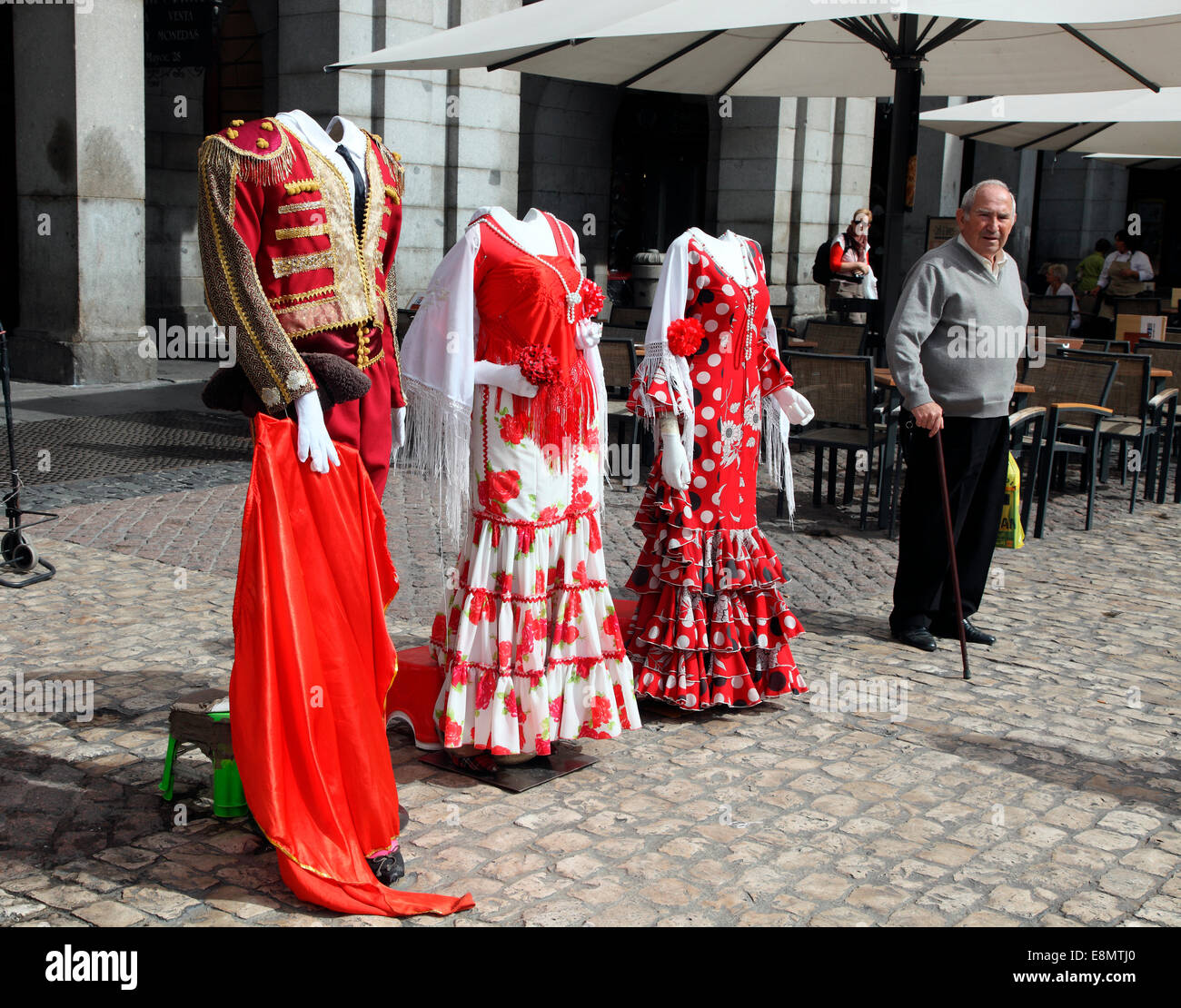 Traditional Spanish costumes displayed in Plaza Mayor in Madrid. Stock Photo