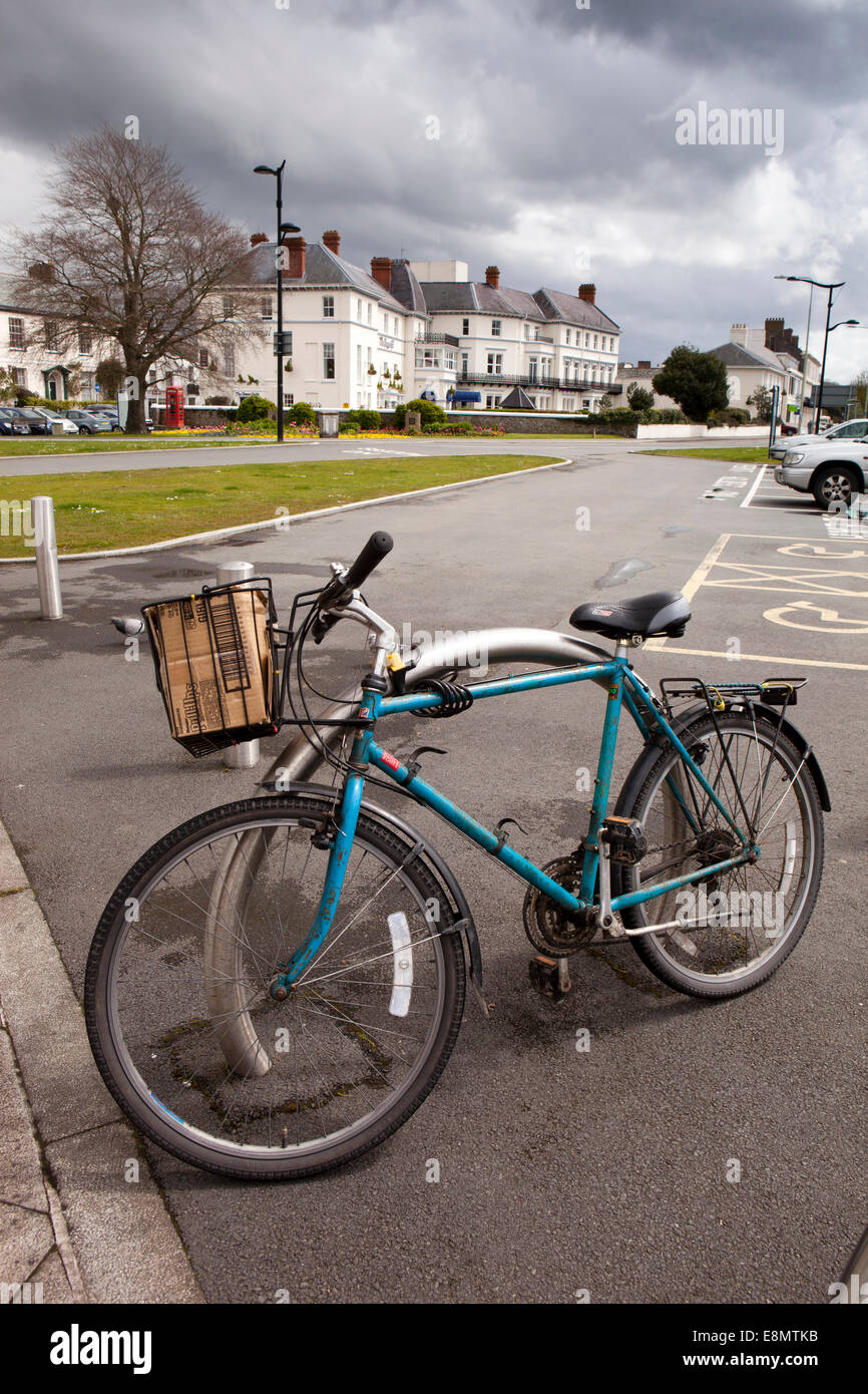 UK, England, Devon, Barnstaple The Square, bicycle securely locked to post with anti-theft chain Stock Photo