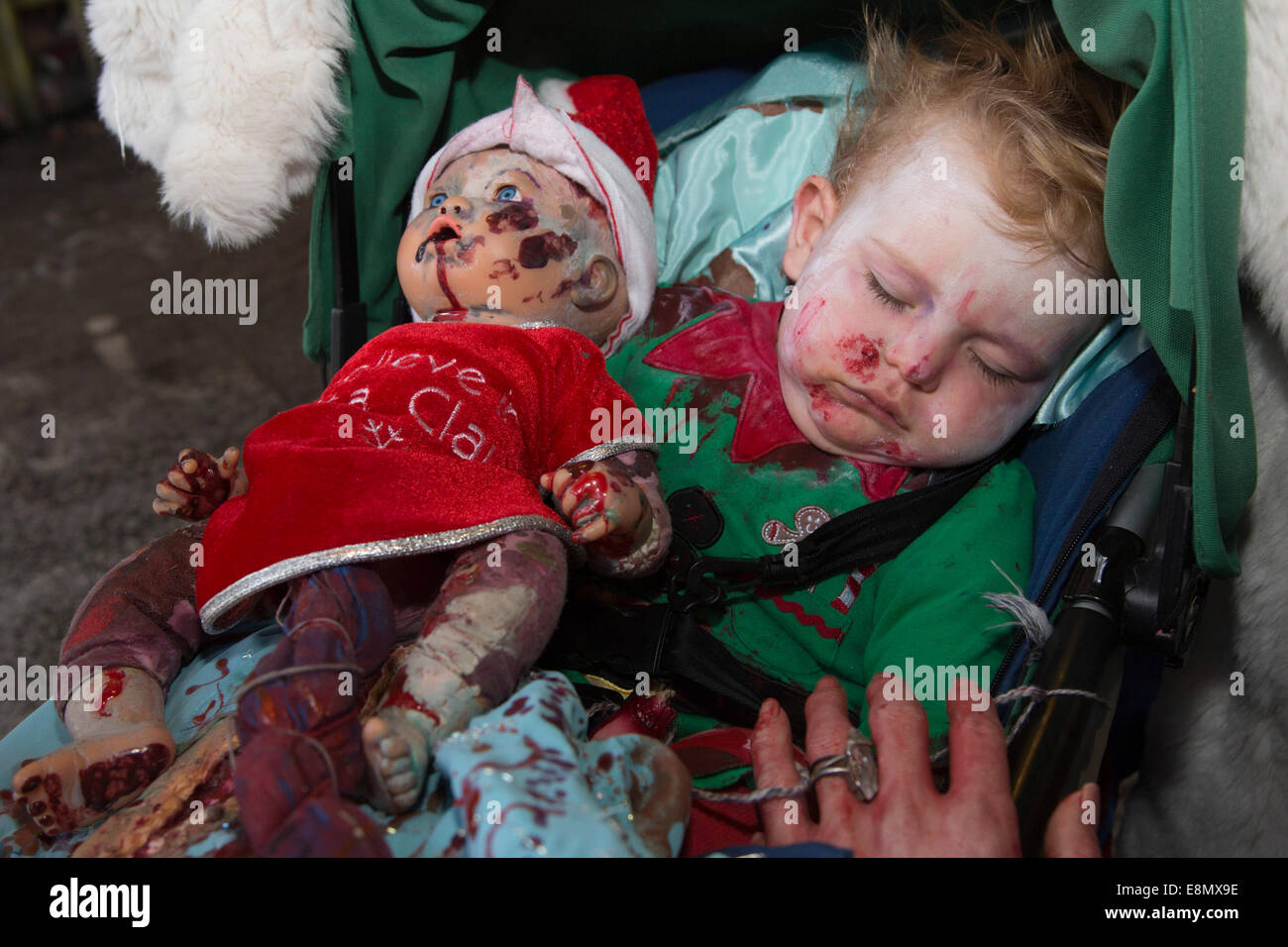 London, UK. 11 October 2014. Pictured: A Zombie-Baby. Hundreds of scary Zombies gathered on World Zombie Day 2014 in the graffiti-covered tunnel underneath Waterloo Station, before setting off on a trek through Central London. Credit: Nick Savage/Alamy Live News Stock Photo