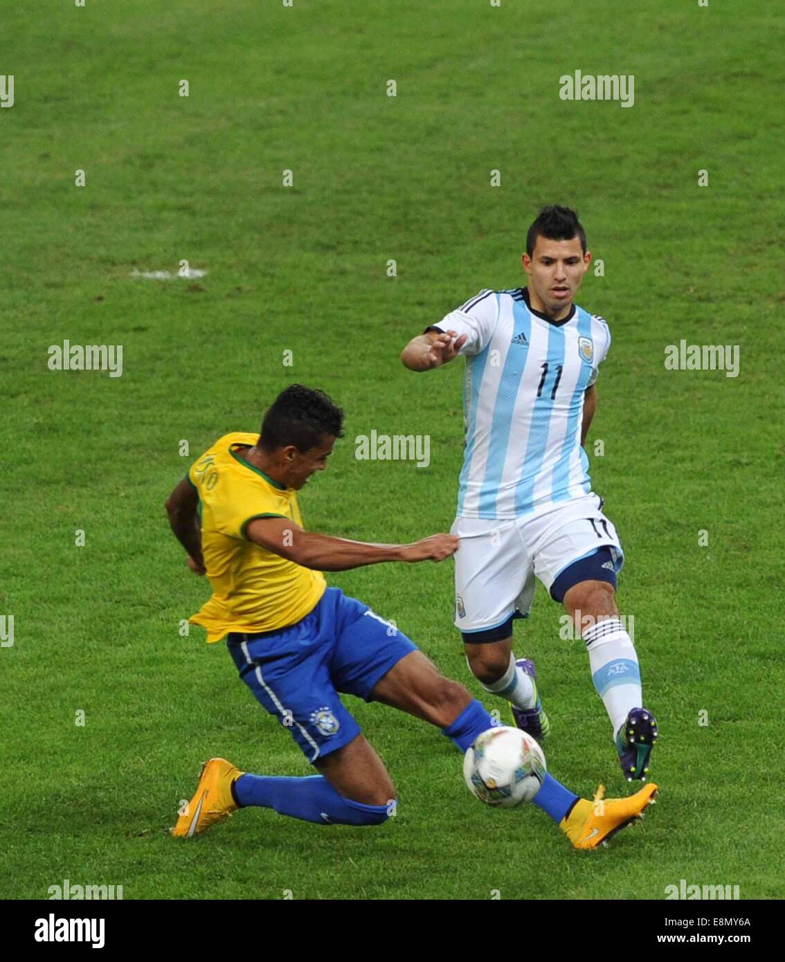 Beijing, China. 11th Oct, 2014. Argentina's Sergio Aguero (R) vies for the ball during a friendly match against Brazil in Beijing, capital of China, Oct. 11, 2014. Credit:  Gong Lei/Xinhua/Alamy Live News Stock Photo