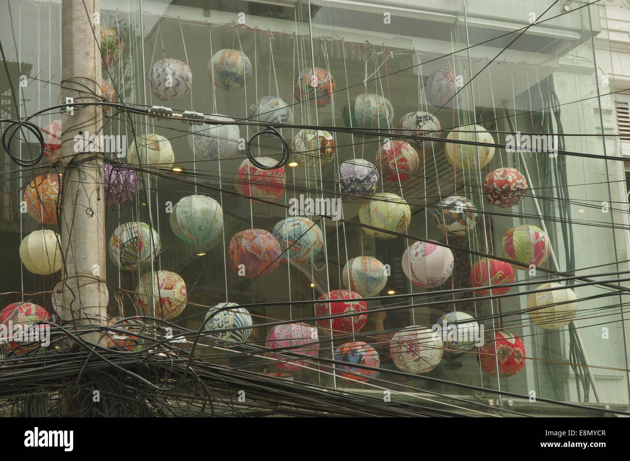 Windows full of colorful balls, behind set of wires Stock Photo