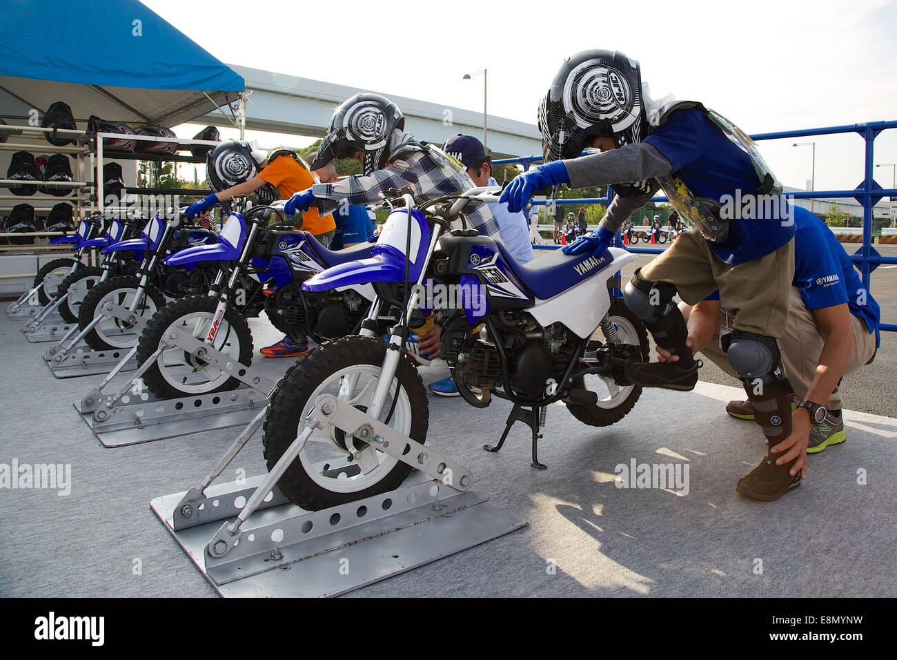 Odaiba, Tokyo, Japan. 11th Oct, 2014. Children test Yamaha motorcycles during the Tokyo Motor Fes 2014. The Tokyo Motor Fes 2014 runs from October 11th to 13th with the aim of giving visitors of all ages a chance to interact with current and futuristic motorized vehicles. Held outside on reclaimed land in Tokyo Bay the event has enough space for visitors to test new vehicles and for a synchronized driving demonstration by the Cirque de Mobi. This year Mercedes-Benz and BMW will also participate along with 13 Japanese makers. Credit:  Aflo Co. Ltd./Alamy Live News Stock Photo