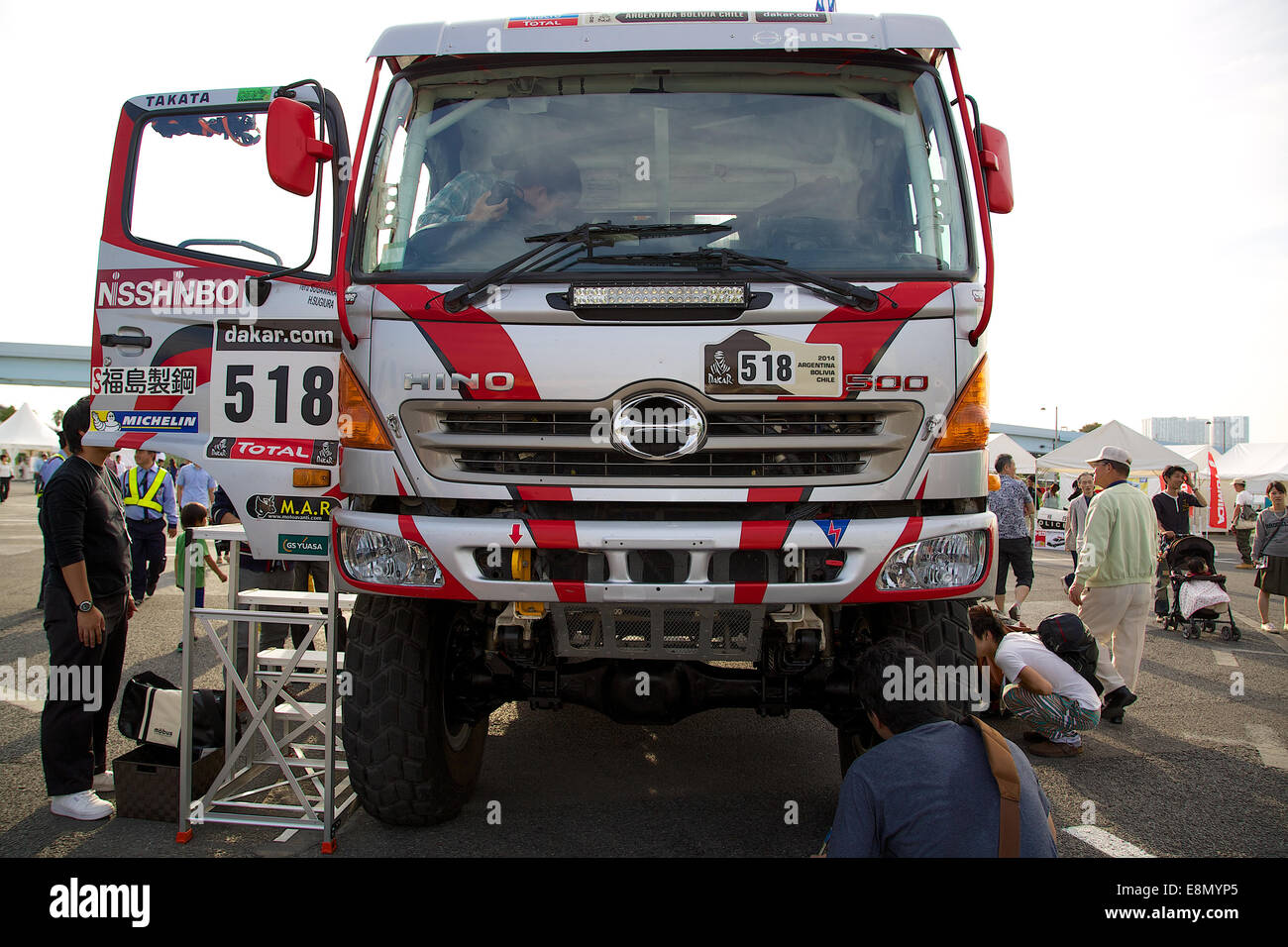 Odaiba, Tokyo, Japan. 11th Oct, 2014. Visitors see the truck 'Hino 500' during the Tokyo Motor Fes 2014. The Tokyo Motor Fes 2014 runs from October 11th to 13th with the aim of giving visitors of all ages a chance to interact with current and futuristic motorized vehicles. Held outside on reclaimed land in Tokyo Bay the event has enough space for visitors to test new vehicles and for a synchronized driving demonstration by the Cirque de Mobi. This year Mercedes-Benz and BMW will also participate along with 13 Japanese makers. Credit:  Aflo Co. Ltd./Alamy Live News Stock Photo