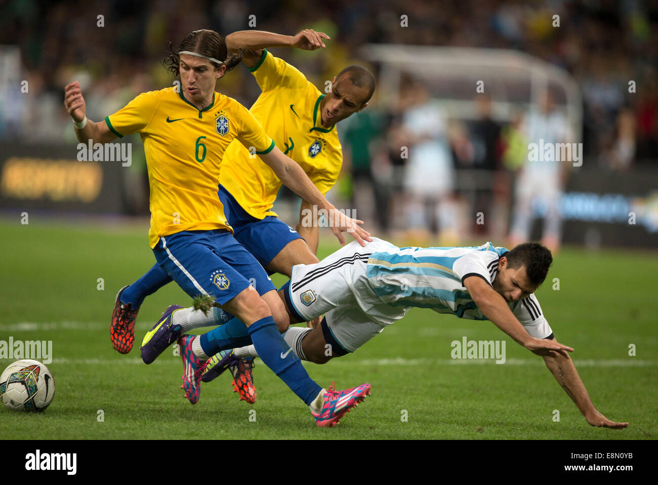 Beijing, China. 11th Oct, 2014. Argentina's Sergio Aguero (R) vies with Brazil's Filipe Luis (L) during a friendly match in Beijing, capital of China, Oct. 11, 2014. Credit:  Fei Maohua/Xinhua/Alamy Live News Stock Photo