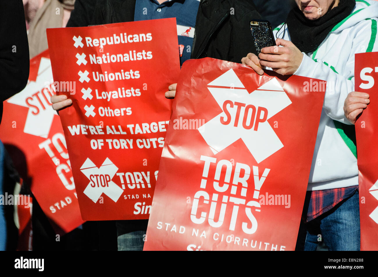 Belfast, Northern Ireland. 11/10/2014 - Banners calling for the end of Tory austerity cuts at a protest. Stock Photo