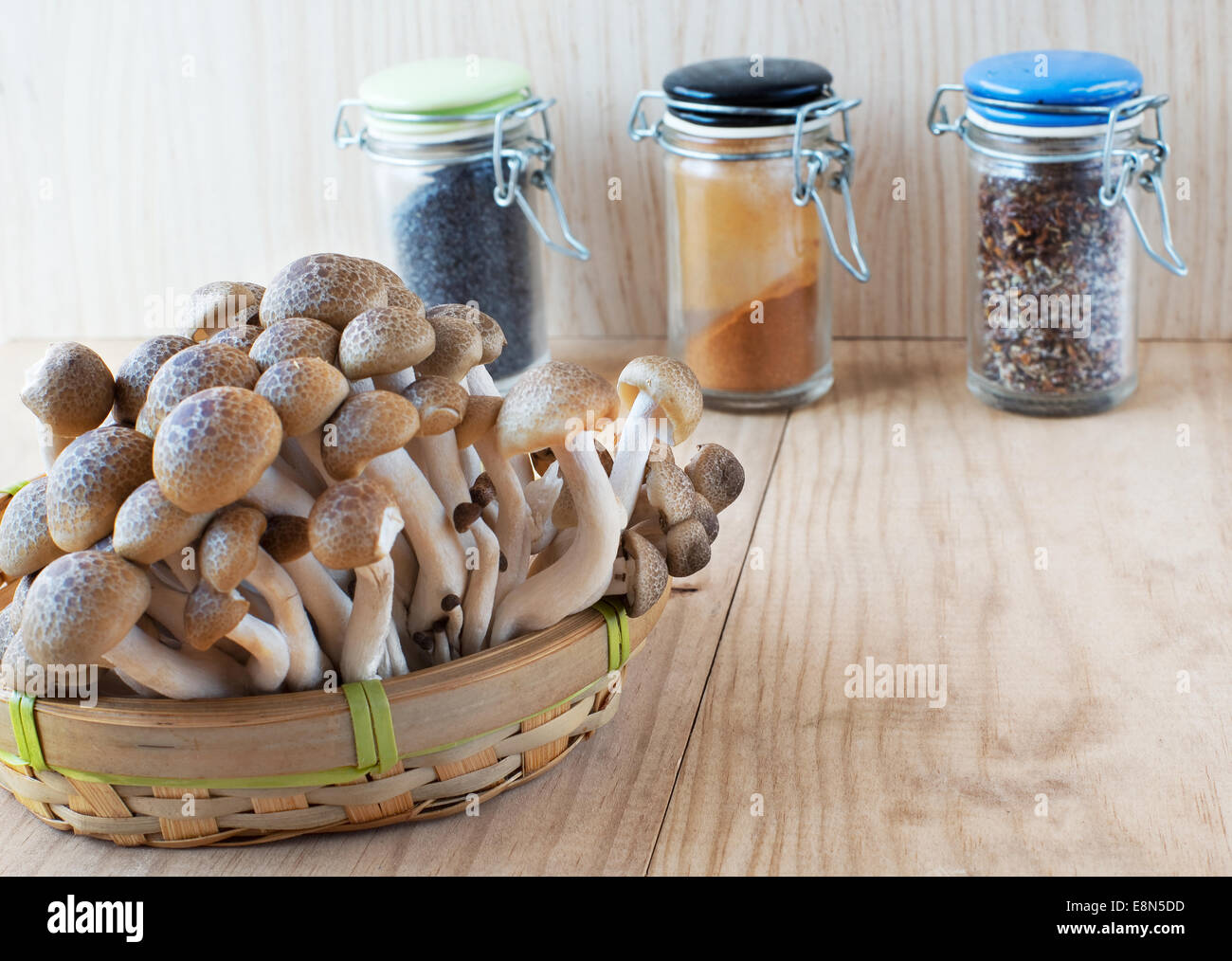 Brown beech, Buna shimeji mushrooms in a rustic wooden table. Stock Photo