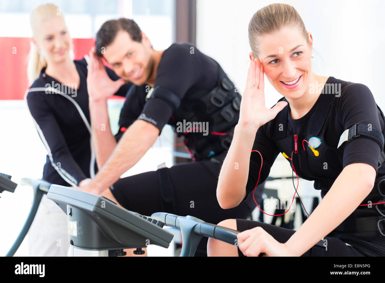 EMS Electro Stimulation Women Exercises with Coach in Modern Gym Stock  Image - Image of fitness, personal: 147937565