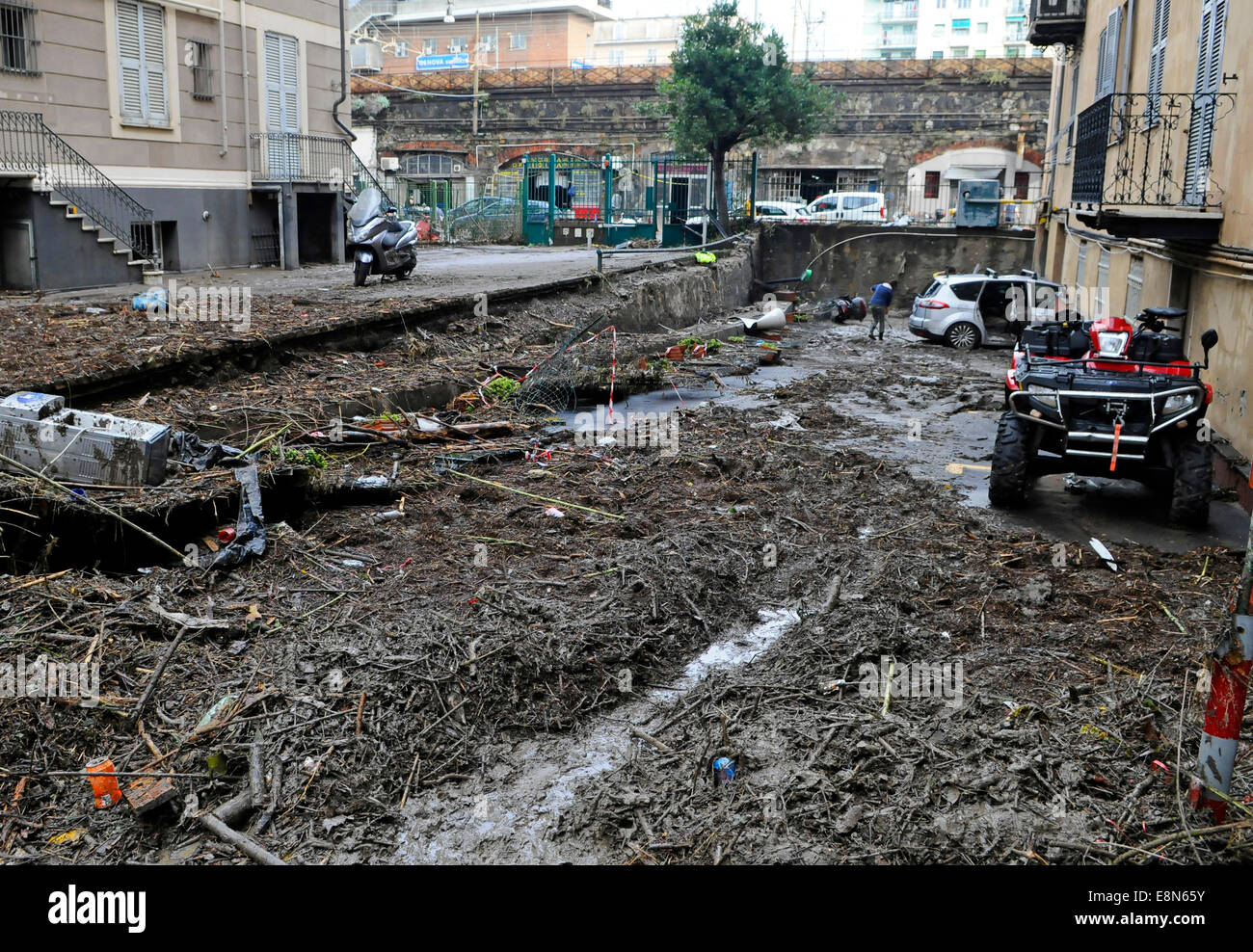 Genoa, Italy. 11th Oct, 2014. Aftermath of the flooding. At least one person died when flash floods swept through the northwestern Italian city of Genoa. Shop windows were smashed, cars washed aside and many streets were left knee deep in muddy water. Credit:  Massimo Piacentino/Alamy Live News Stock Photo