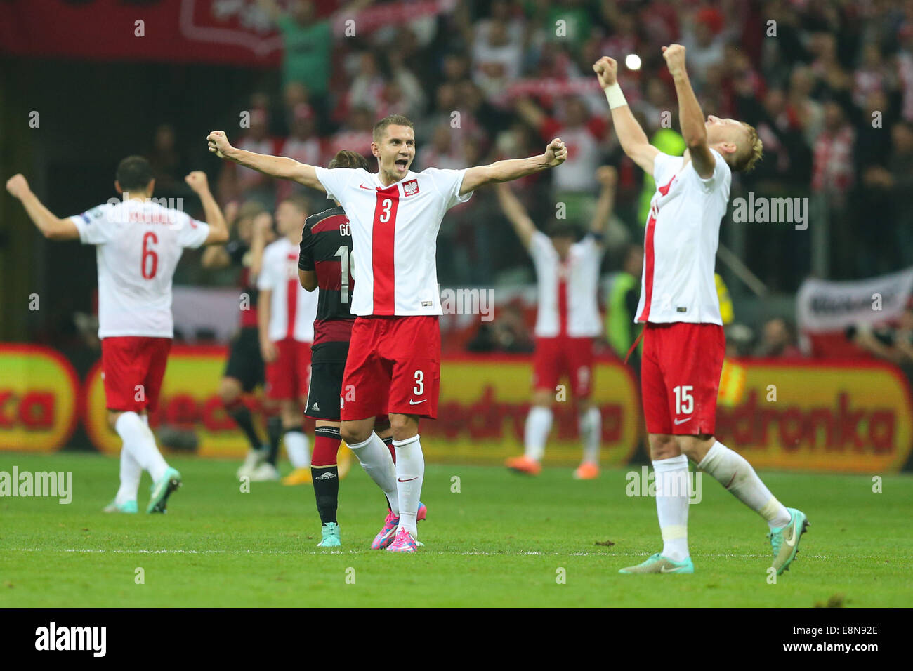 Warsaw, Poland. 11th October, 2014. Euro 2016 football qualification process. Poland versus Germany. Artur Jedrzejczyk, Kamil Glik (POL) celebrate their win over their old enemy Credit:  Action Plus Sports Images/Alamy Live News Stock Photo