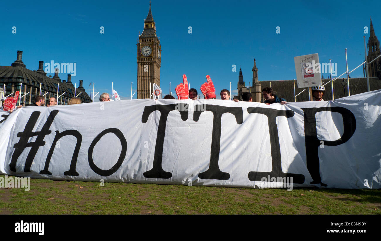 Parliament Square, London UK. 11th October 2014. Demonstrations take place with Anti TTIP banners in Parliament Square on a European wide No TTIP Day of Action protest against the Transatlantic Trade & Investment Partnership which wants to transfer powers to Corporations thereby destroying democratic rights of society especially the National Health Service.  Kathy deWitt/Alamy Live News Stock Photo