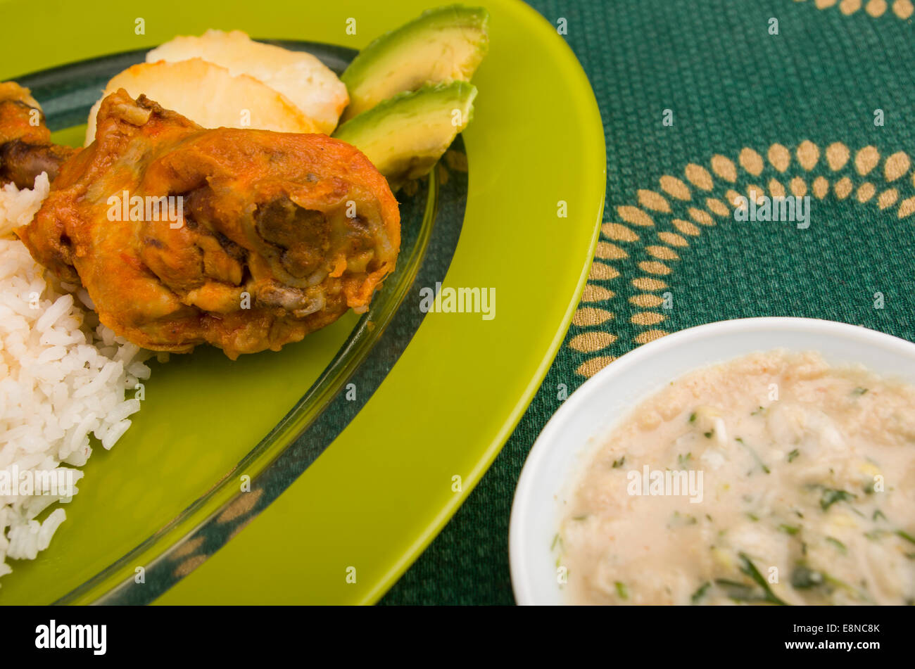 chicken served with white rice potato on a plate Stock Photo