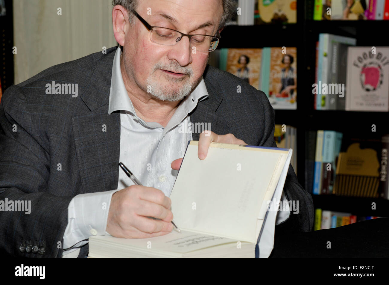 Salman  Rushdie, novelist,  Man Booker Prize winner and writer of Midnight's Children and The Satanic Verses signs books at the Cheltenham Literary Festival 10th October, 2014  Gloucestershire uk Credit:  Prixnews/Alamy Live News Stock Photo