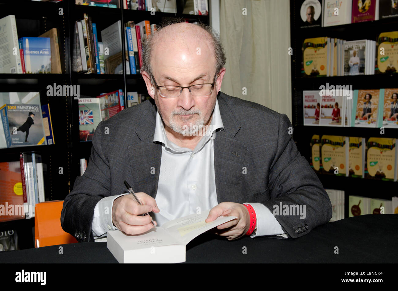 Salman  Rushdie, novelist,  Man Booker Prize winner and writer of Midnight's Children and The Satanic Verses signs books at the Cheltenham Literary Festival 10th October 2014 Gloucestershire Uk Credit:  Prixnews/Alamy Live News Stock Photo