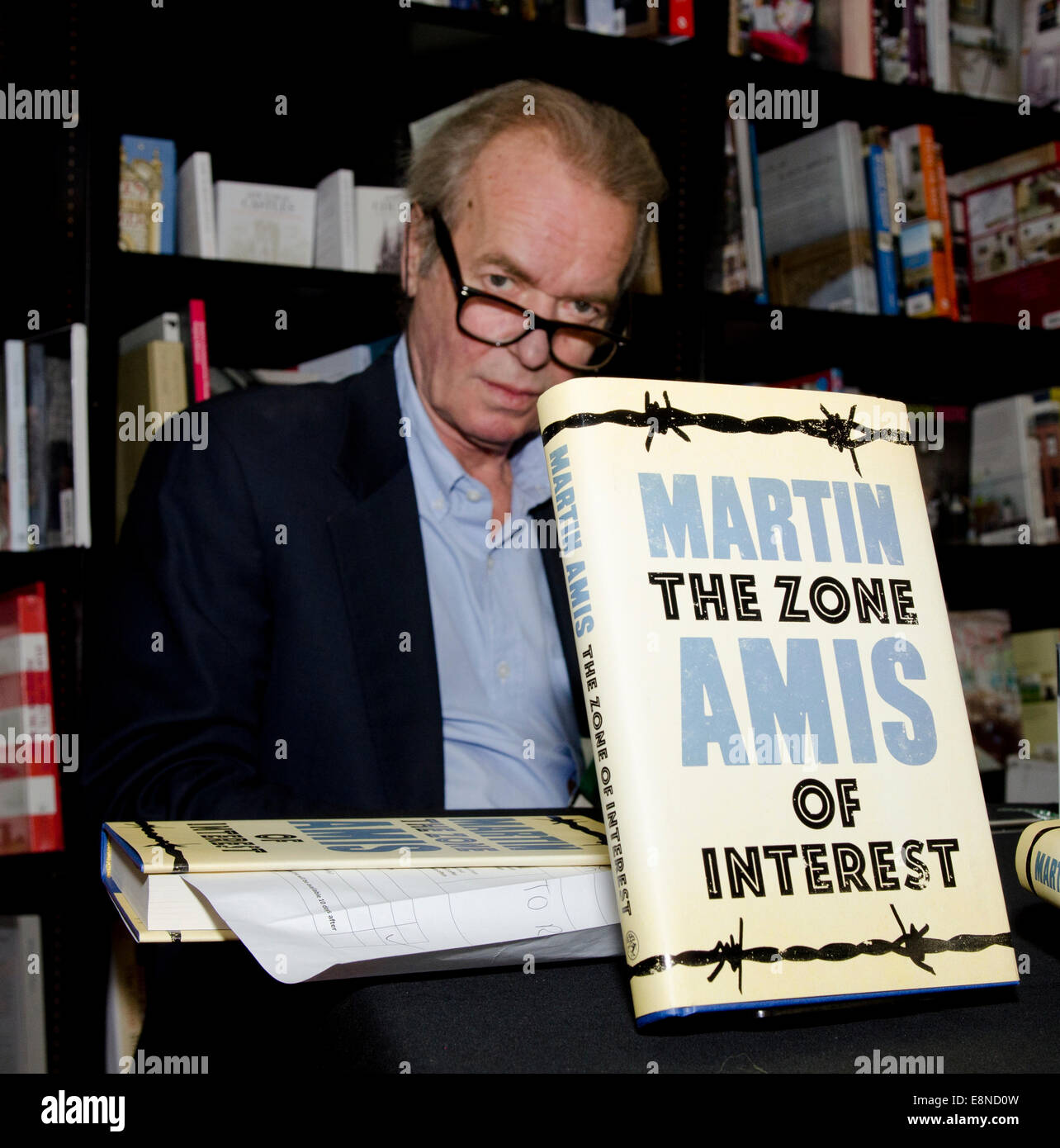 Martin Amis novelist, writer of Money, London Fields and Times Arrow signs his latest book The Zone of Interest  at the Cheltenham Literary Festival 2014 Credit:  Prixpics/Alamy Live News Stock Photo