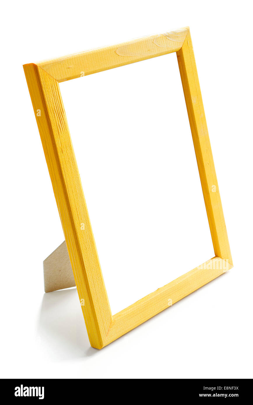 yellow wooden picture frame stay on the white table Stock Photo