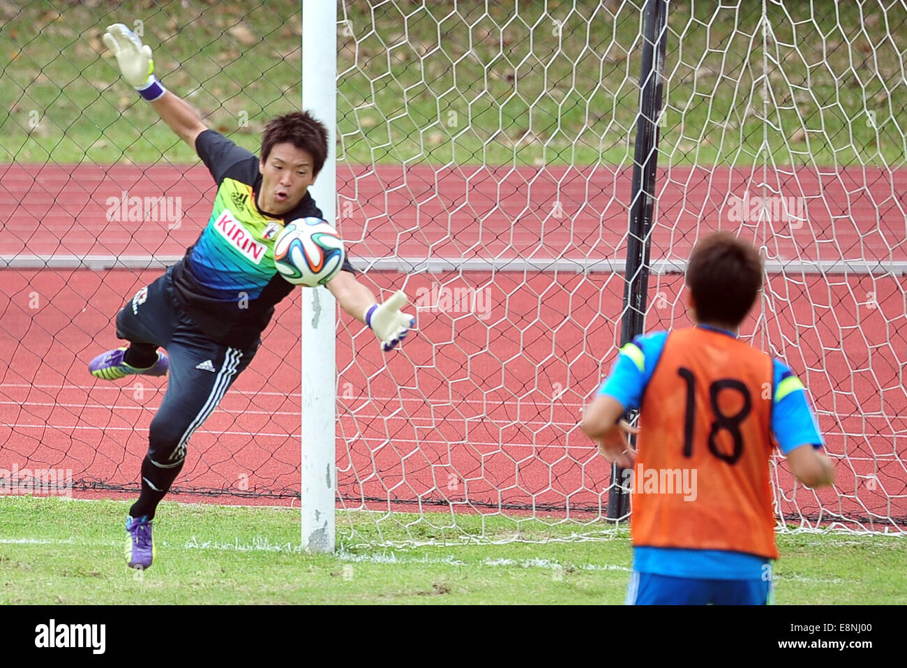 Singapore. 12th Oct, 2014. Nishikawa Shusaku (L) of Japan's football team attends the training session at Singapore's Bishan Stadium in Singapore, on Oct. 12, 2014. Japan and Brazil will have a friendly game at Singapore's National Stadium on Oct. 14. © Then Chih Wey/Xinhua/Alamy Live News Stock Photo