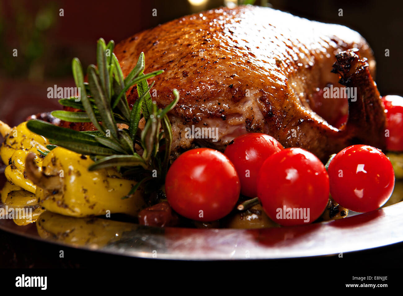 Christmas roast duck served on a festive table Stock Photo Alamy