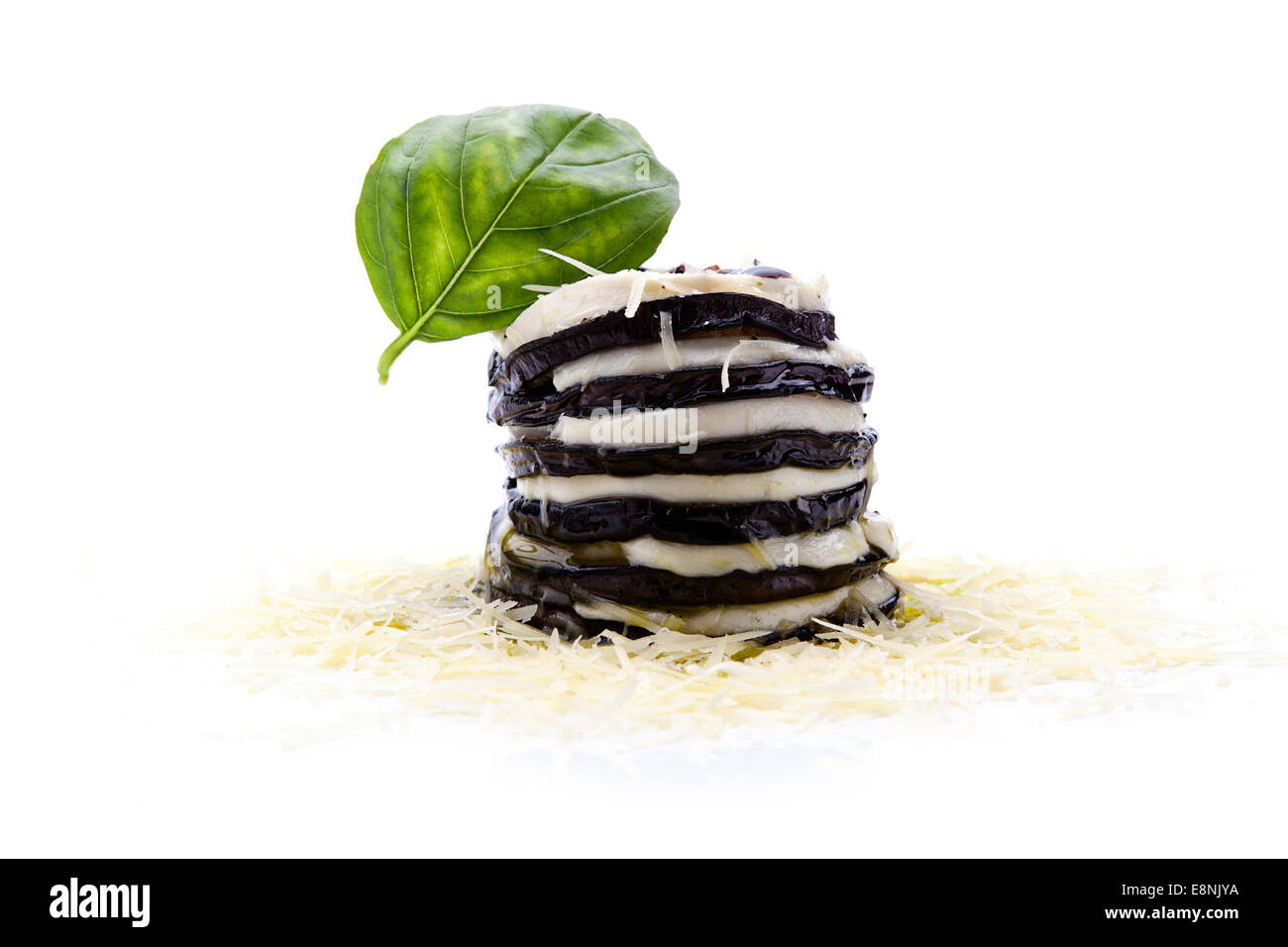 Roasted aubergine slices garnished with mozzarella, basil leave on a