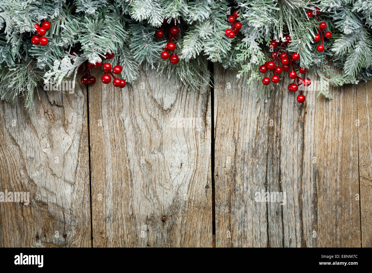 Christmas fir tree on grunge wooden background Stock Photo